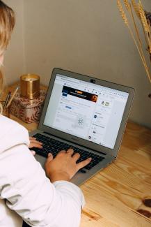 a man using a laptop by Swello courtesy of Unsplash.