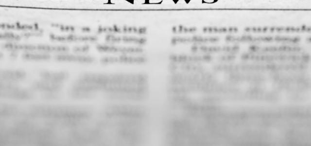 A news paper with the word news on it by John Cardamone courtesy of Unsplash.