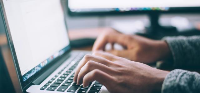 person using MacBook Pro by Glenn Carstens-Peters courtesy of Unsplash.